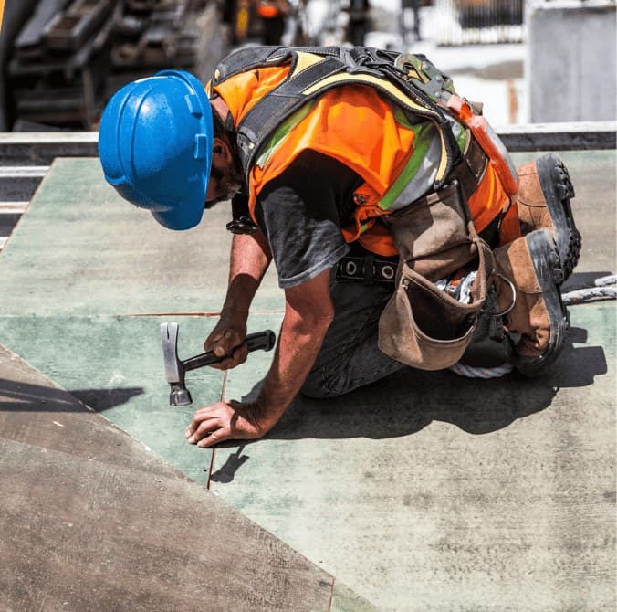 Roofer working on a low-slope roof