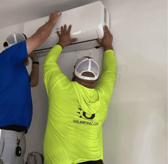 SolarFIX technicians mounting an indoor mini split unit