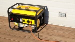 Portable tri-fuel generator connected outside a home