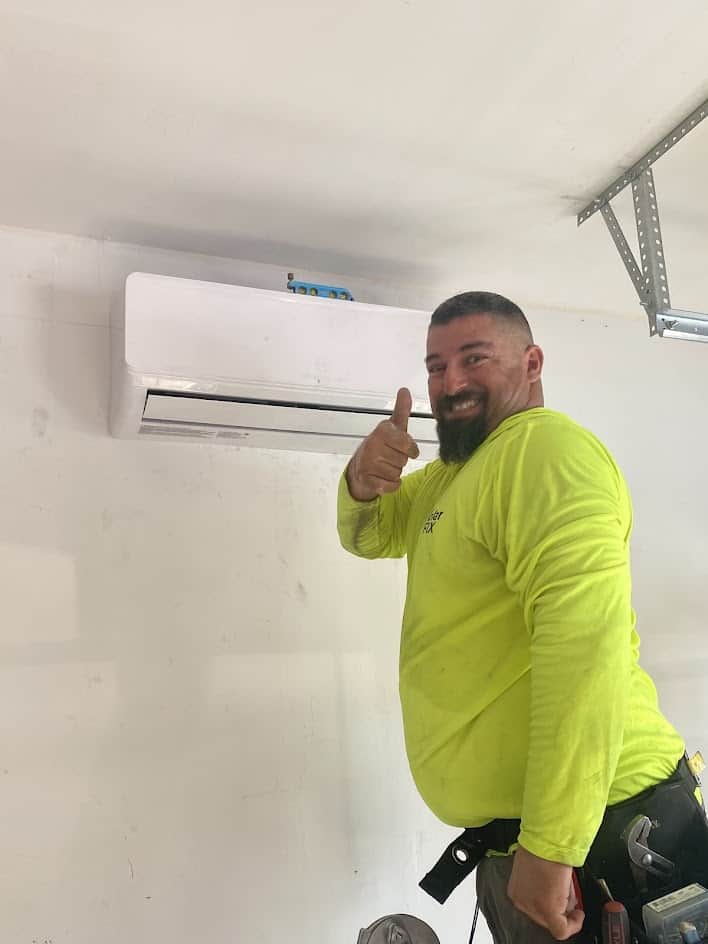 SolarFIX installer next to a newly installed mini split