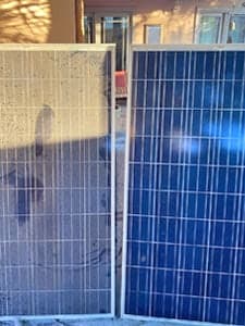 Clean and dirty solar panels side by side