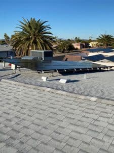 SolarFIX crew reinstalling solar panels on a roof